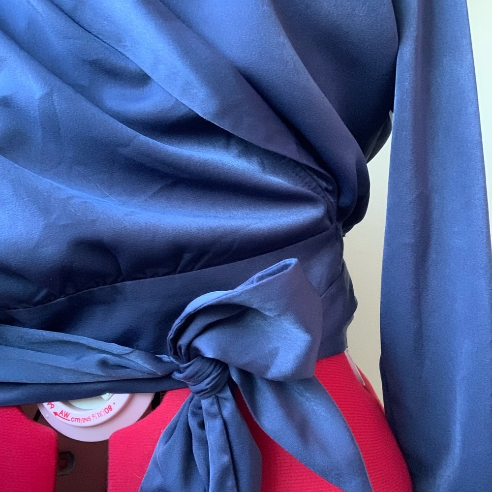Blue slate satiny wrap top is classy and comfortable. From a boutique in LA